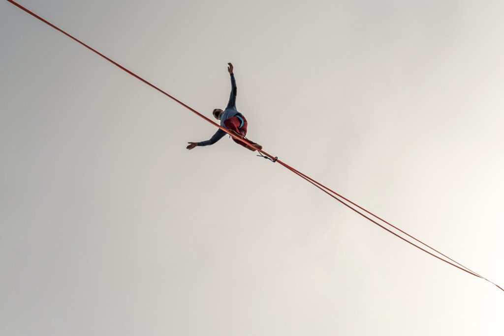 A man balancing on a tight rope.