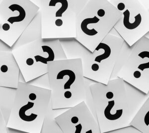 Bold black question marks on paper cards