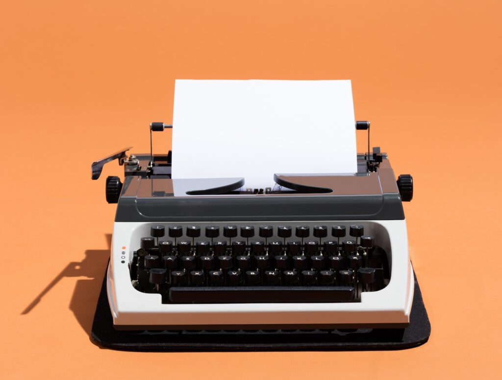 Oldschool typewriter with a blank page