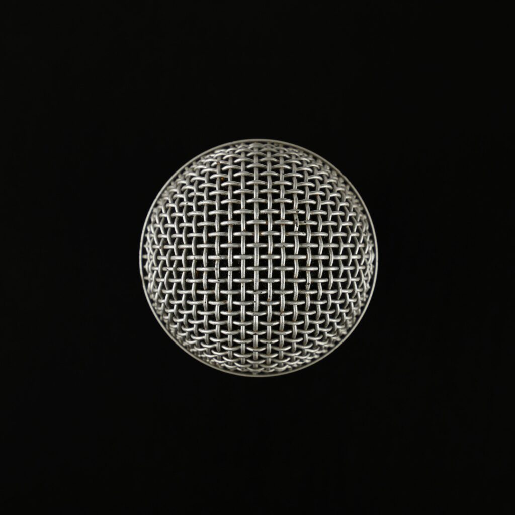 Microphone close up top view over black